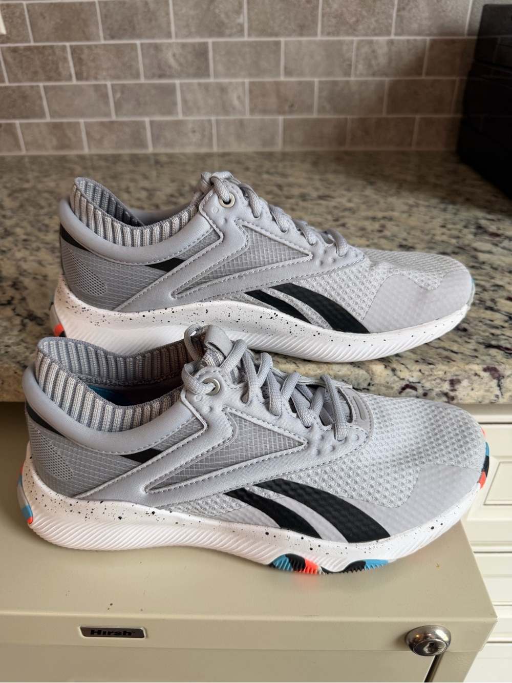 Reebok Light Gray Athletic Shoes with Blue, Black and Orange Accents